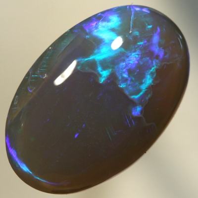 SOLID BLACK CRYSTAL OPAL Two large rolling flashes, green and turquoise shades SEE VIDEO
